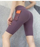 Pantalones de yoga ajustados con cintura alta y secado rápido para correr, de cinco puntos, color melocotón, con realce de cadera y elasticidad.